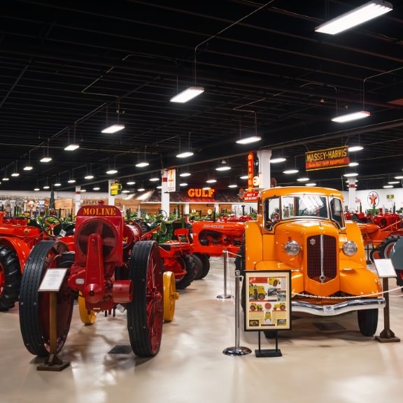 dozens of antique trucks and tractors on display